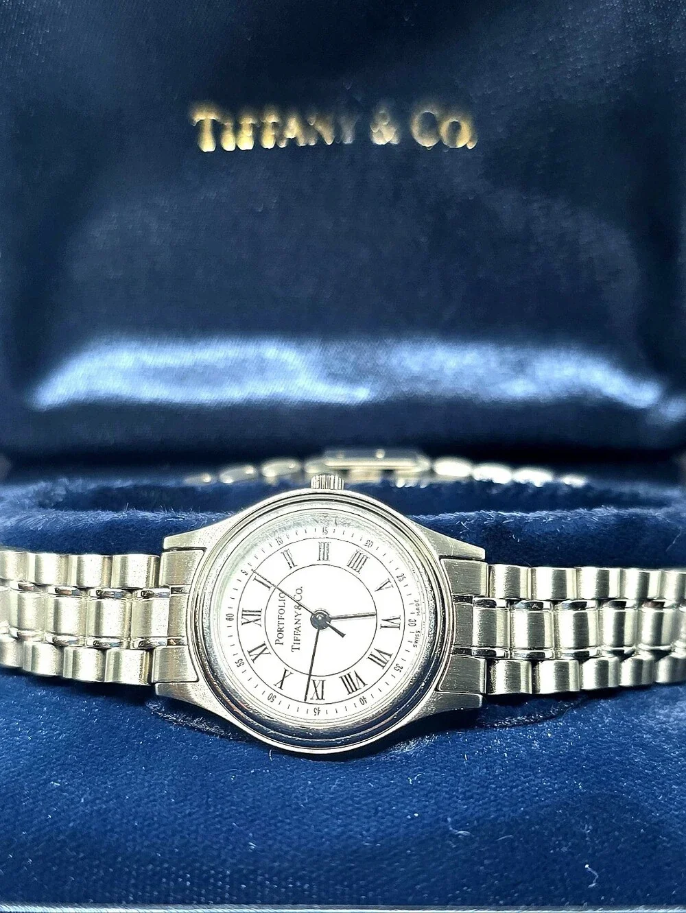 Tiffany & Co. Portfolio Stainless Steel Quartz Watch (Pre-loved) with its origin